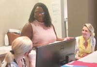 Clinical Operations Manager Carolyn Baldwin, center, with team members at the Center for Lymphoid Malignancies, ColumbiaDoctors.